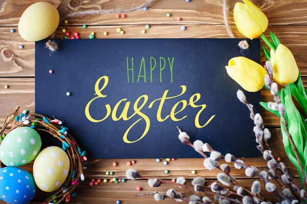 Happy Easter. Congratulatory easter background. Easter eggs and flowers.
