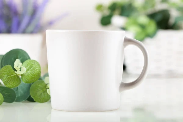 Blank White Mug Mockup on on a background of flowers. Template Space for Creative Artwork Lettering Text Product Promotion Branding. Elegant style.