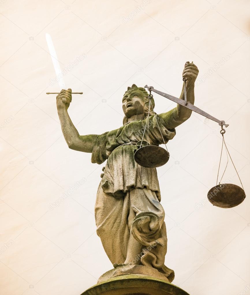 Lady Justice sculpture with sword and scales — Stock Photo © manfredxy