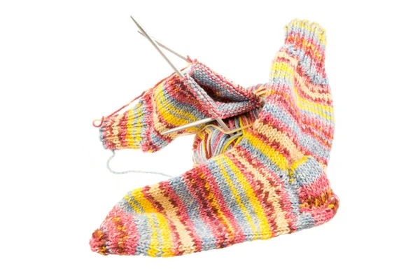 Isolated woolen socks with knitting equipment — Stock Photo, Image