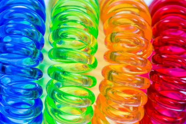 Abstract background of various spiral hair ties — Stock Photo, Image