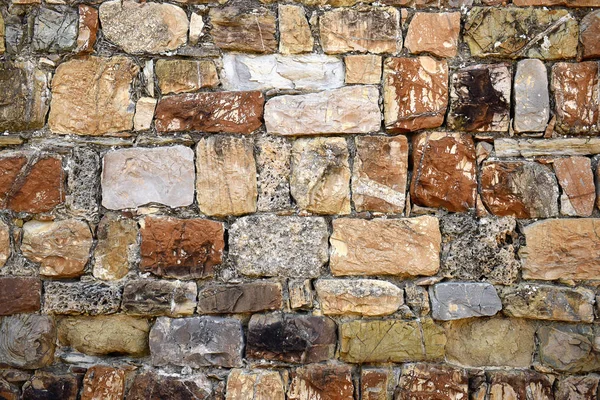 Kleurrijke stenen muur — Stockfoto