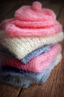 Pile of soft mohair hand knit clothes clipart