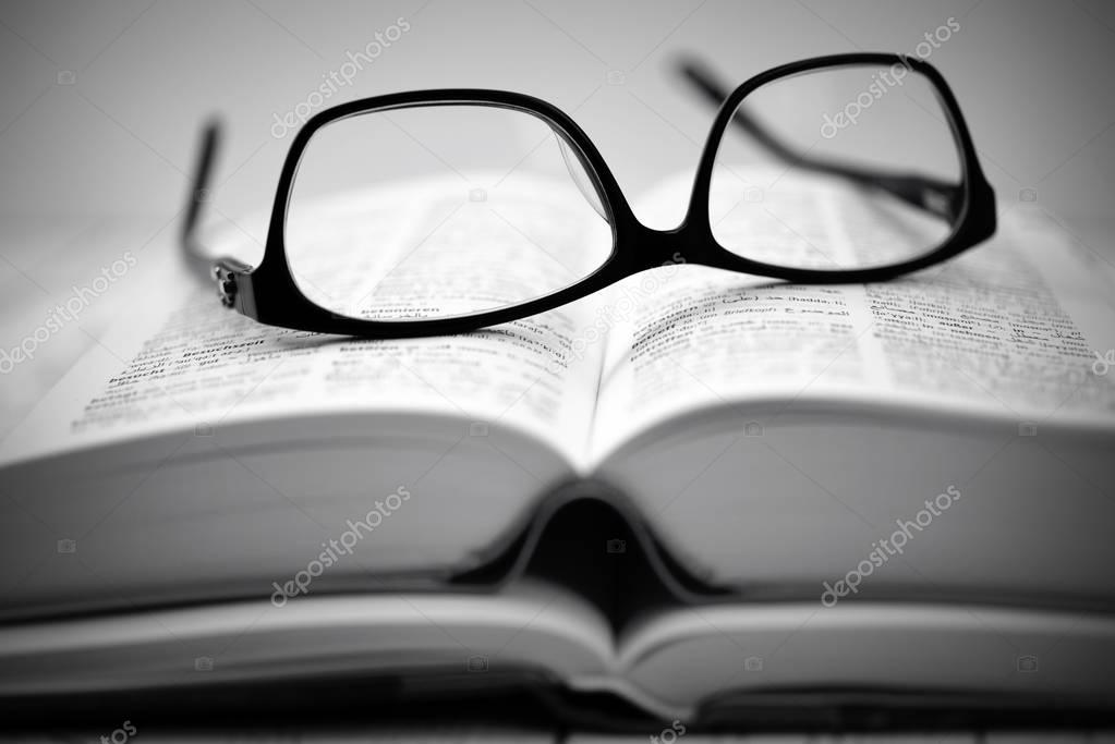 Glasses on an open book