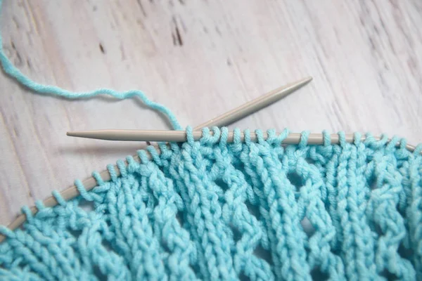 Close Photo Blue Knitted Sweater Knitting Needles Wooden Table Background Stock Photo