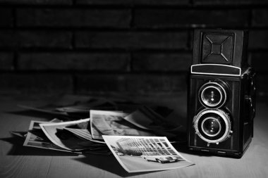 Old camera and films on white background. Vintage camera and films clipart