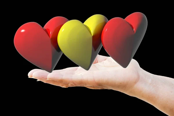 İspanyol bayrağı renkleri ile üç hearts tutan bir kadın eli — Stok fotoğraf
