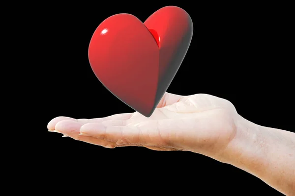 Büyük kırmızı bir kalp tutan kadının el. — Stok fotoğraf
