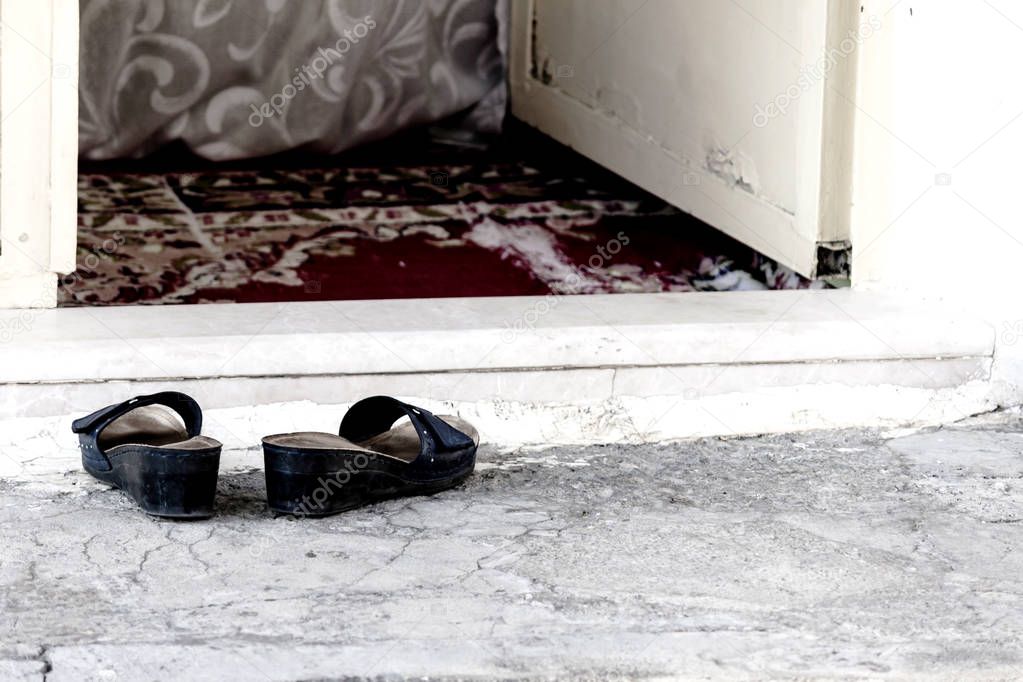 Slippers on the threshold of a poor home in Turkey