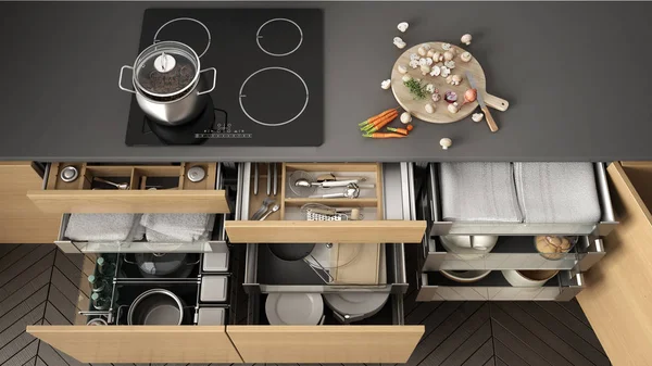 Opened wooden kitchen drawer with accessories inside, solution f
