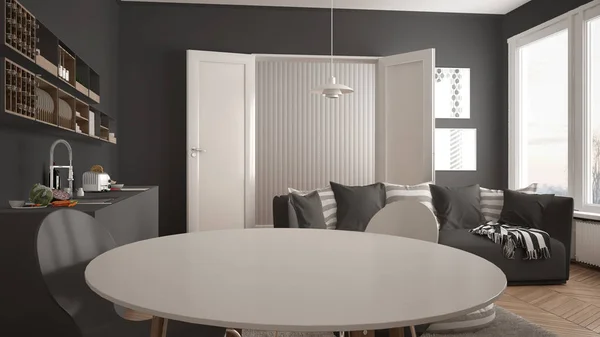Skandynawskie nowoczesny salon z kuchnia, stół jadalny, kanapa i dywan z poduszkami, minimalistyczne białe i szare architektura wnętrz — Zdjęcie stockowe
