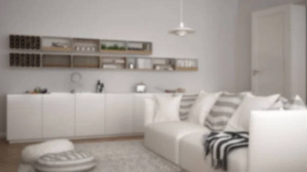 Rozmycie tła wnętrz, skandynawskie nowoczesny salon z kuchnia, stół jadalny, kanapa i dywan z poduszkami, minimalistyczna architektura biały — Zdjęcie stockowe