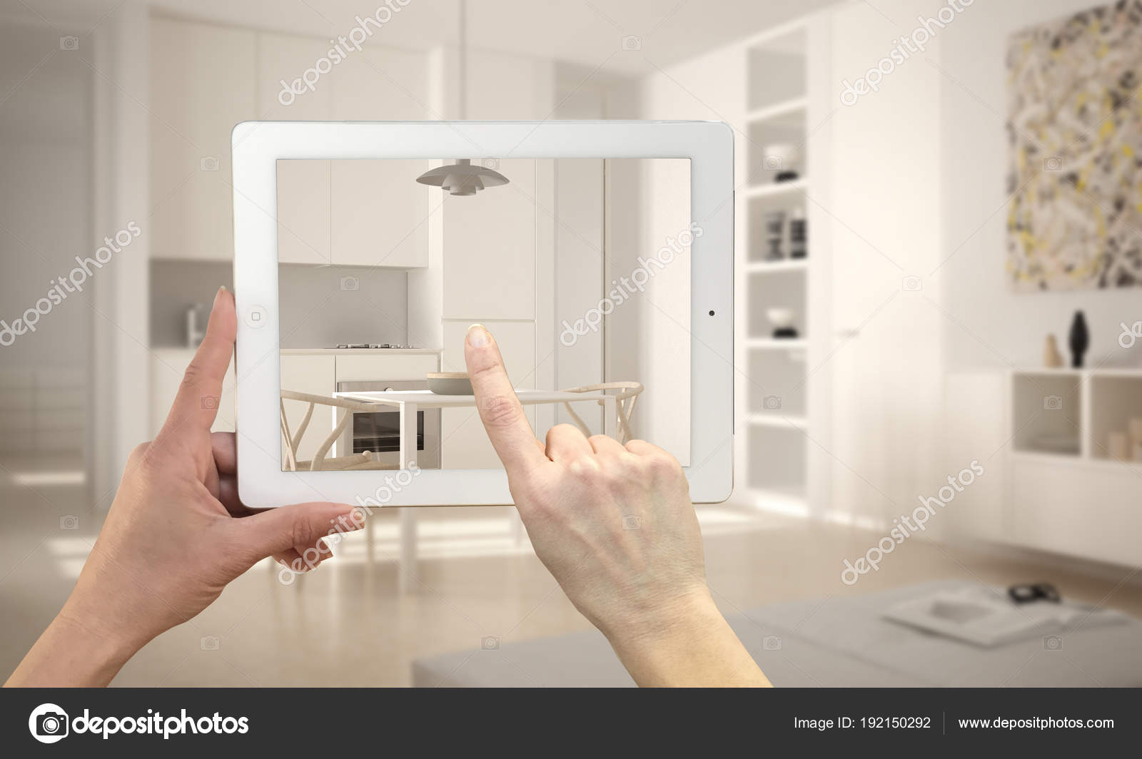 Hands Holding And Pointing On Tablet Showing Modern Kitchen