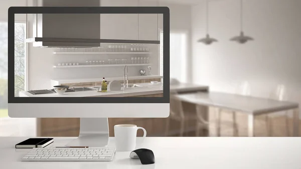 Architektenhaus-Projektkonzept, Desktop-Computer auf weißem Schreibtisch mit weißer Holzküche, minimalistisches unscharfes Interieur im Hintergrund — Stockfoto