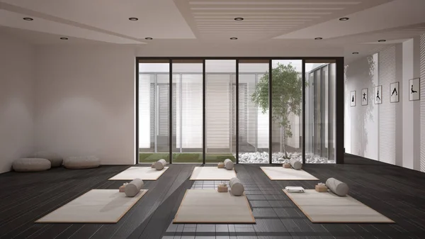 Empty yoga studio interior design, open space with mats, pillows and accessories, parquet, patio house, inner garden with tree and pebbles, ready for yoga practice, meditation room