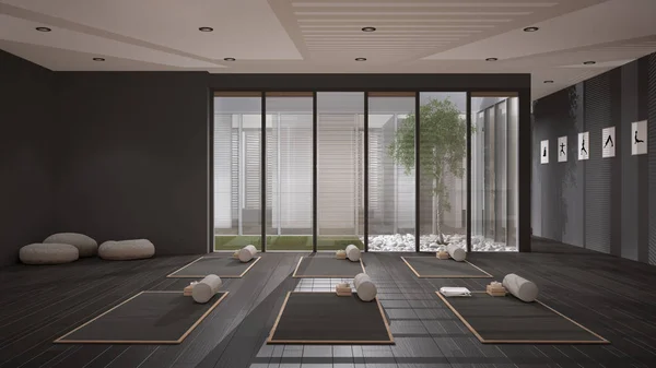 Empty yoga studio interior design, open space with mats, pillows and accessories, parquet, patio house, inner garden with tree and pebbles, ready for yoga practice, meditation room