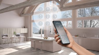 Telefon uygulamasında akıllı ev teknolojisi arayüzü, artırılmış gerçeklik, şeylerin interneti, bağlı nesnelerle modern mutfağın iç tasarımı, kadın el kumandası cihazı