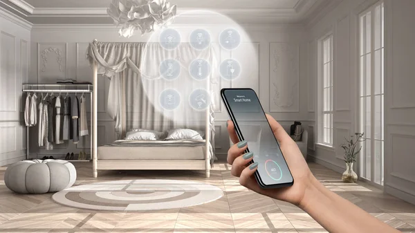 Smart home technology interface on phone app, augmented reality, internet of things, interior design, classic bedroom with connected objects, woman hand holding remote control device