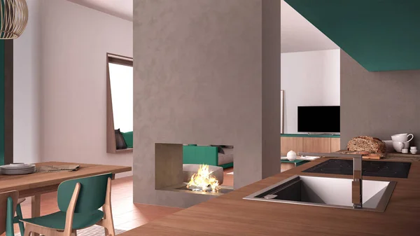 舒适的绿松石和木制厨房，配有餐桌和椅子，混凝土现代壁炉和墙壁，有沙发的客厅，梯形瓷砖地板，当代室内设计 — 图库照片