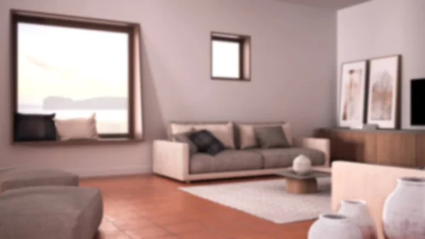 Blur bakgrund inredning, mysigt vardagsrum med soffa och kuddar, lounge, matta, soffbord med vaser, puff och inredning, stort fyrkantigt fönster, modern arkitektur — Stockfoto