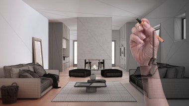 Kanepe, halı, masa ve puf, beton, modern şömine ve duvarları olan özel yapım gri ve bej bir oturma odası. Tamamlanmamış proje mimarisi iç tasarım