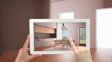Gelişmiş gerçeklik kavramı. Terracotta döşemeleri ve rahat mutfağı olan içi boş mobilya ve tasarım ürünlerini taklit etmek için kullanılan Ar uygulamalı el bilgisayarı tableti.