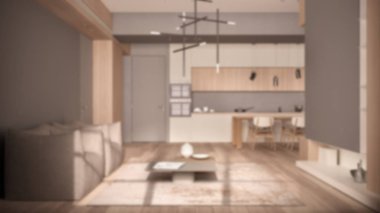 Arka plan bulanık tasarım, bej renkte minimalist oturma odası ve mutfak ahşap ve beton detaylar, sandalyeli yemek masası, parke, koltuklar, halı ve masalar.