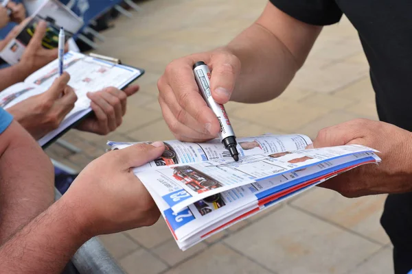 LE MANS, FRANCE - JUNE 11, 2017: Brochure with the team of racers of Fabien Barthez - famous former french goalkeeper and racer 11 june 2017- Weighing, administrative and technical checks of the race — Stock Photo, Image