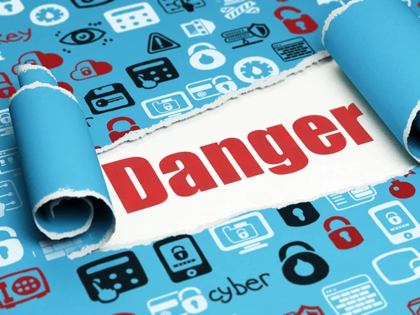 Protection concept: red text Danger under the piece of  torn paper — Stock Photo, Image
