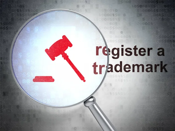 Law concept: Gavel and Register A Trademark with optical glass