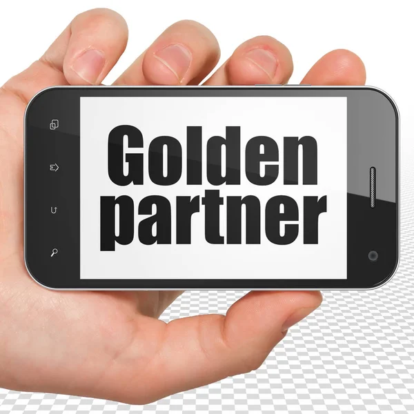 Concept de finance : Smartphone à main avec Golden Partner exposé — Photo