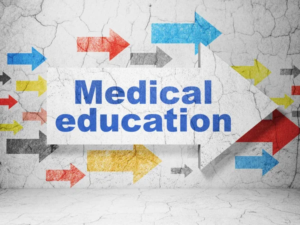 教育理念: グランジ壁背景の医学教育と矢印 — ストック写真