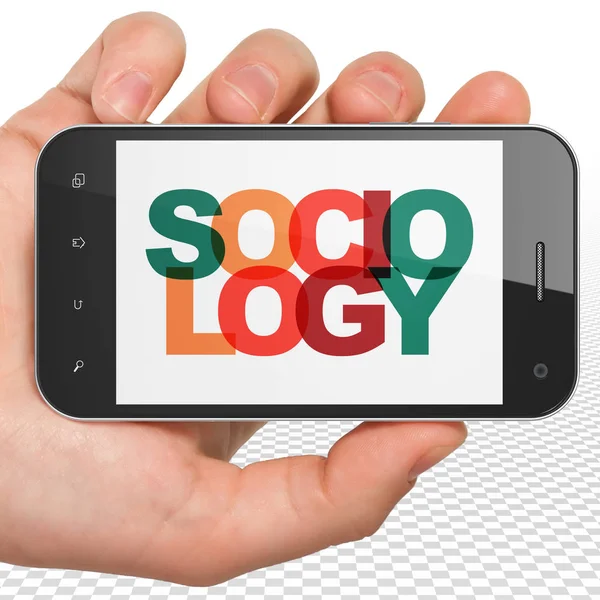 Učebnímu konceptu: ruka držící Smartphone s sociologie na displeji — Stock fotografie