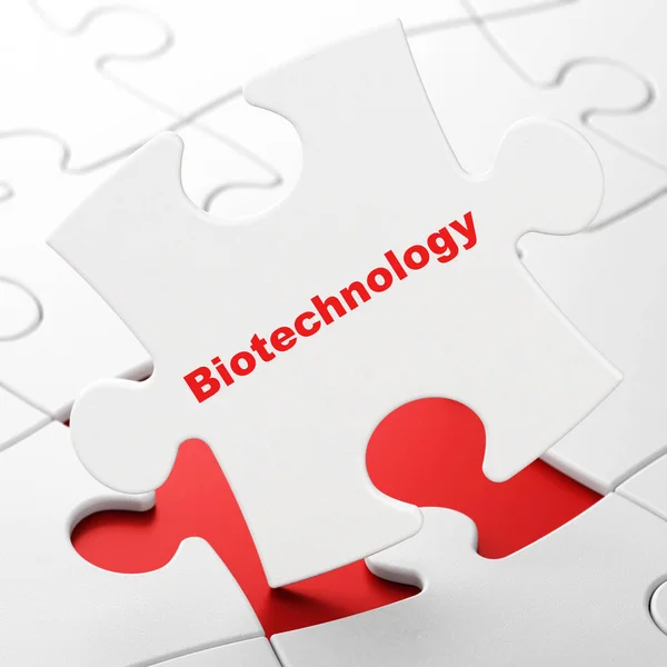 Наукова концепція: біотехнологія на фоні головоломки — стокове фото