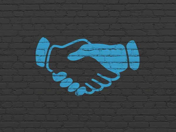 Business concept: Handshake on wall background — Stock Photo, Image