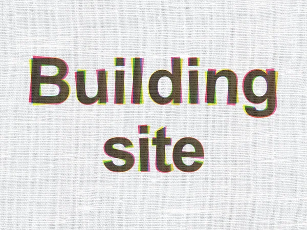 Концепция строительства здания: строительная площадка на фоне текстуры ткани — стоковое фото