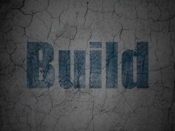 Constructing concept: Build on grunge wall background — Stock Photo, Image