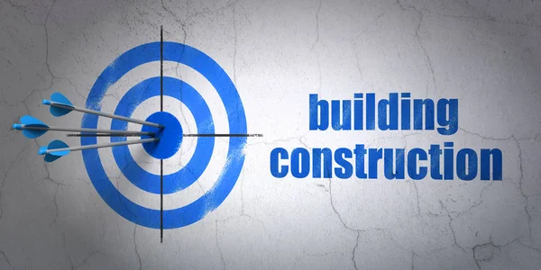 Conceito de construção: alvo e construção civil no fundo da parede — Fotografia de Stock