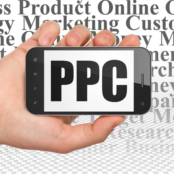 Concept publicitaire : Smartphone à main avec PPC à l'écran — Photo