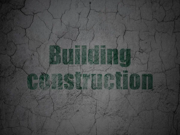 Byggkoncept konstruktion: husbyggnad på grunge vägg bakgrund — Stockfoto