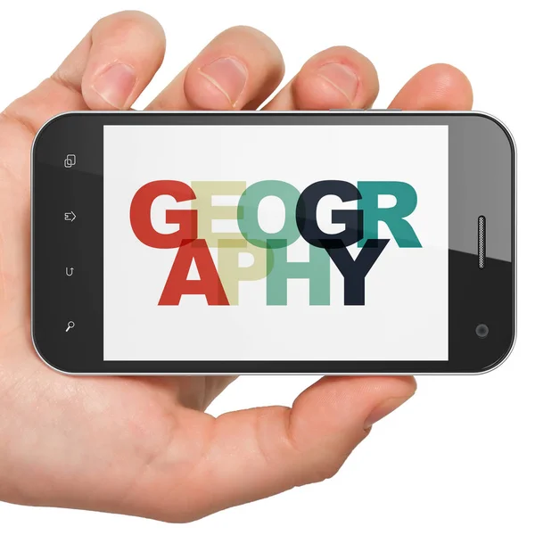 Concepto de aprendizaje: Smartphone de mano con geografía en pantalla —  Fotos de Stock