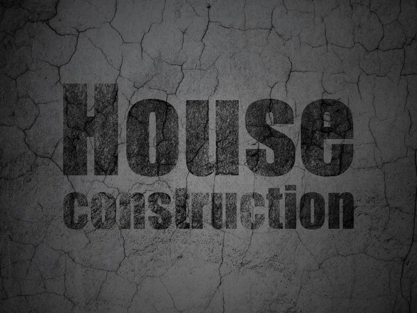Побудова концепції: Будівництво будинку на фоні гранжевої стіни — стокове фото