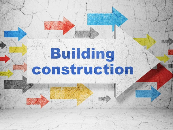 Concetto di costruzione: freccia con costruzione di edifici su sfondo grunge wall — Foto Stock