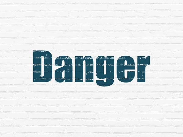 Safety concept: Danger on wall background