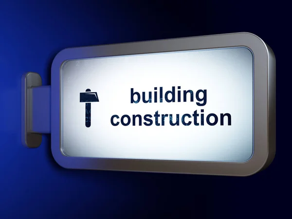 Construction concept: Building Construction and Hammer on billboard background — Stock Photo, Image