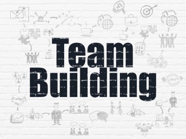 Ekonomi kavramı: duvar arka plan üzerinde ekip oluşturma