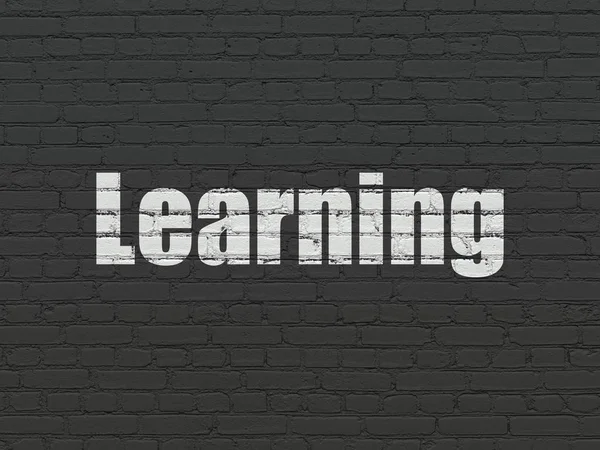 Conceito de aprendizagem: Aprendizagem sobre fundo de parede — Fotografia de Stock