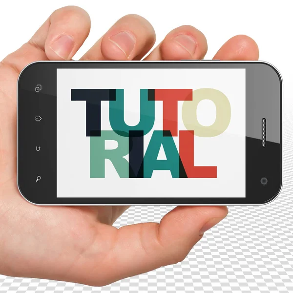 Education concept: Hand Holding Smartphone with Tutorial on  display — Stock Photo, Image