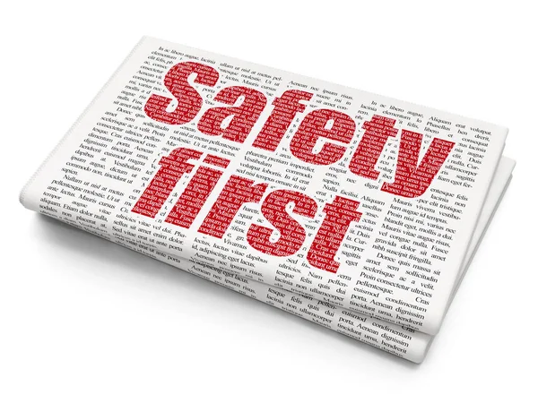 Concept de sécurité : Safety First sur fond de journal — Photo