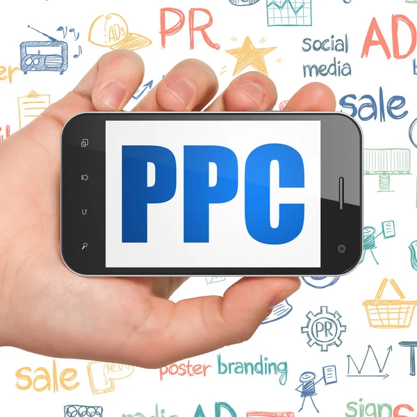 Concepto publicitario: Smartphone de mano con PPC en pantalla — Foto de Stock